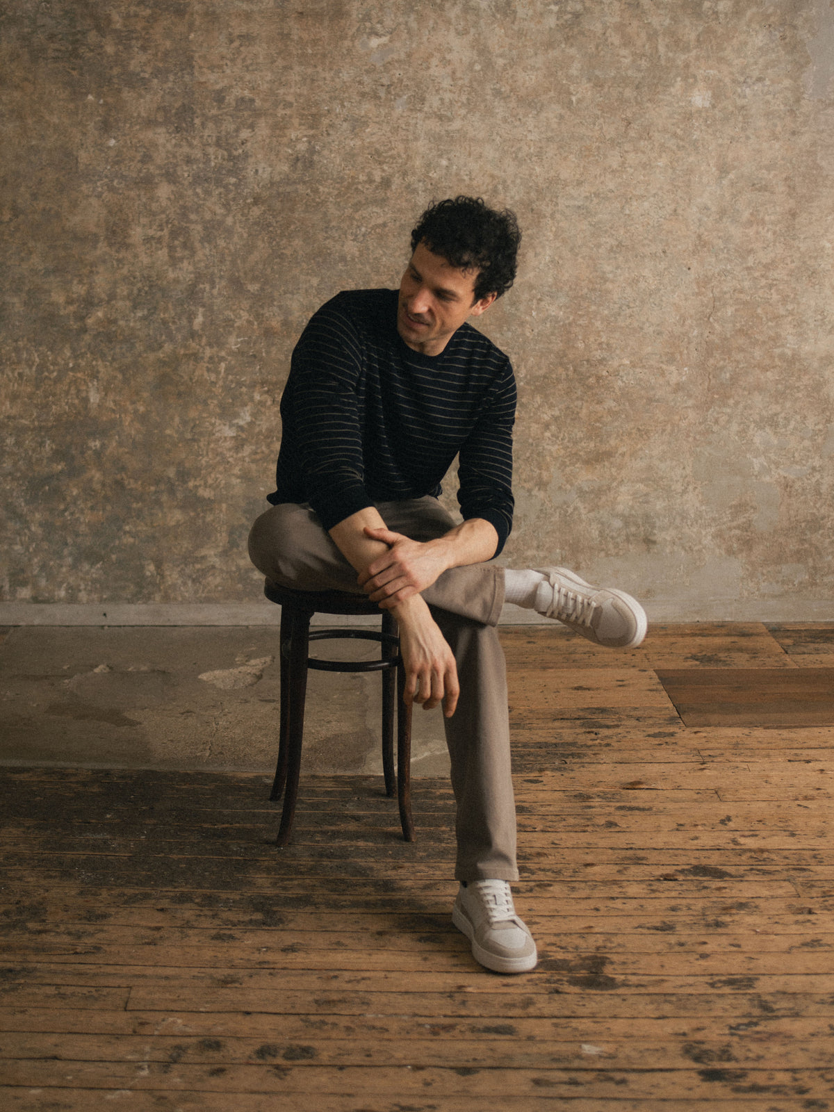 Man sitting on chair wearing Men
